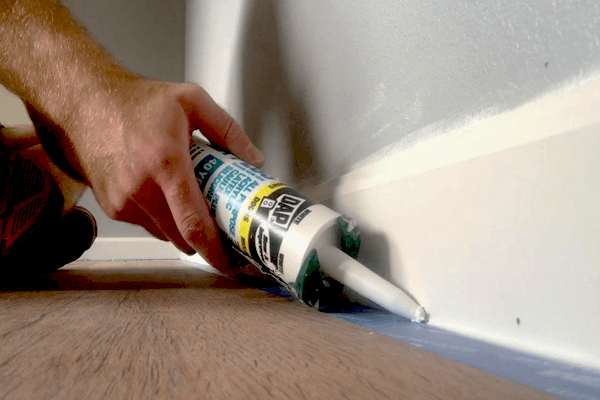 Can you Caulk Between Baseboard and Floorboards